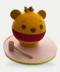 Chocolate Breakable Pooh decorado con abejitas, tabla y martillo L'Autrichienne CDMX