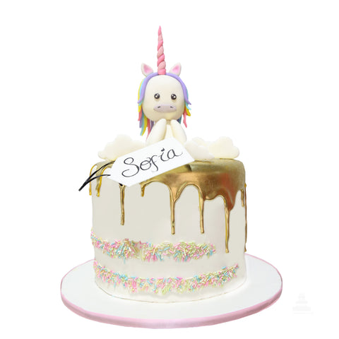 Unicorn Sprinkles Cake, pastel decorado con drip dorado y chispas