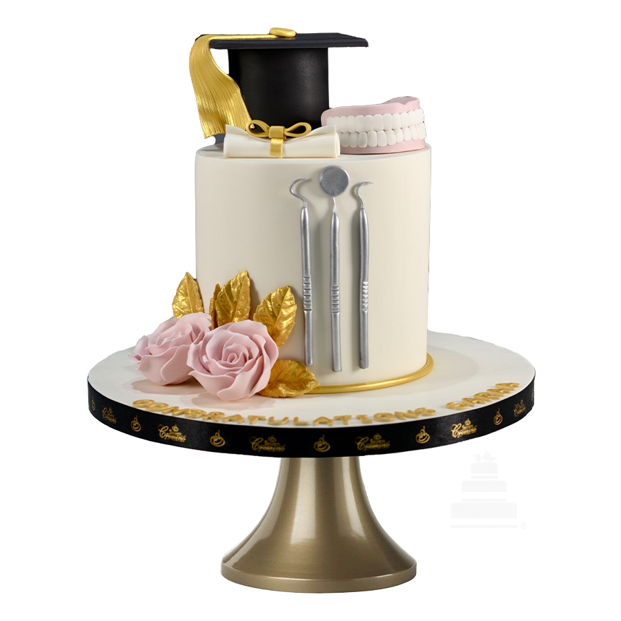 Sweet dentistry cake, pastel para graduación de odontólogo o dentista con  dentadura y birrete y flores así como instrumental hecho en fondant