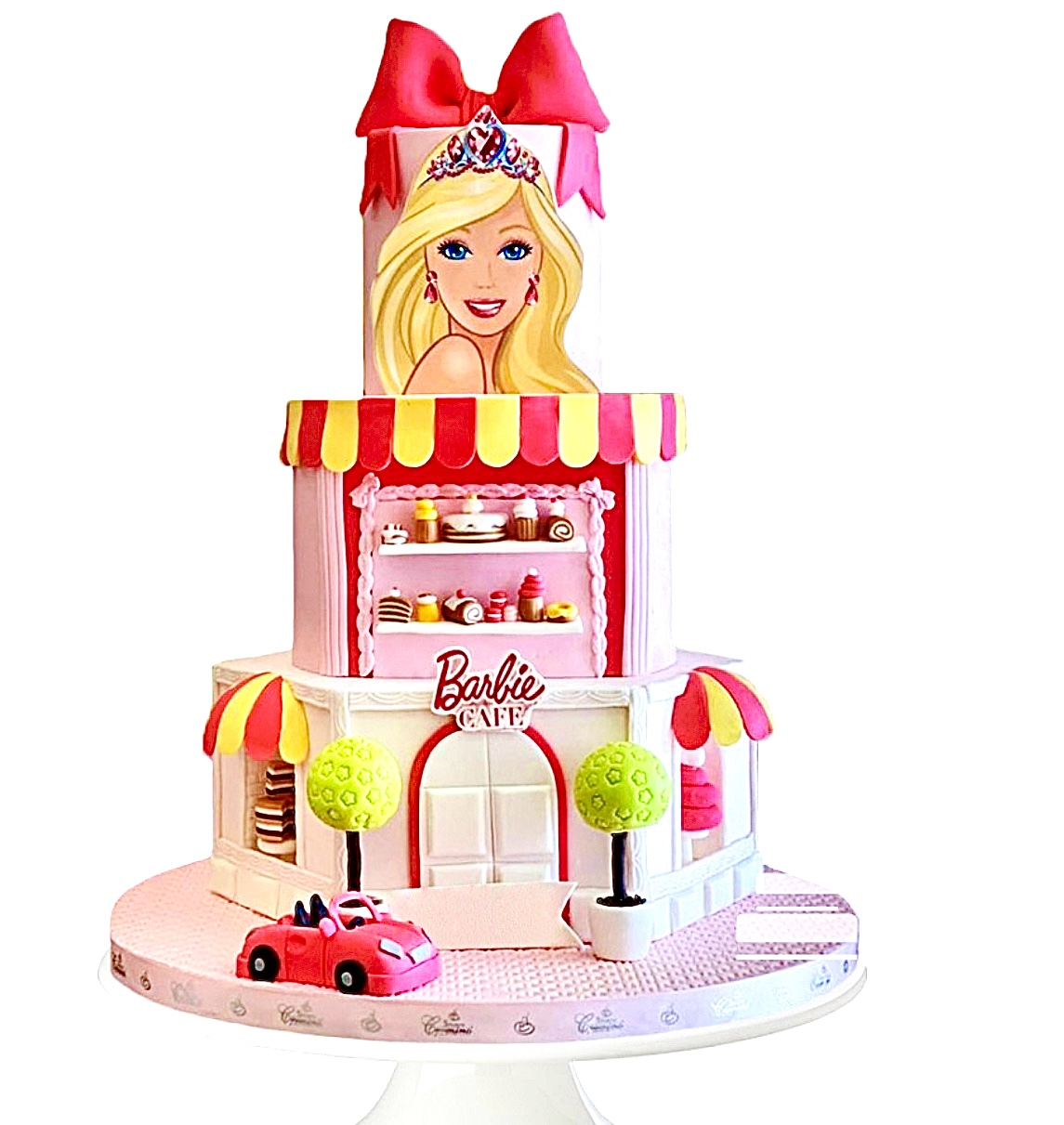 Pastel de Barbie de 3 pisos representando la pastelería de Barbie , cara de Barbie y moño